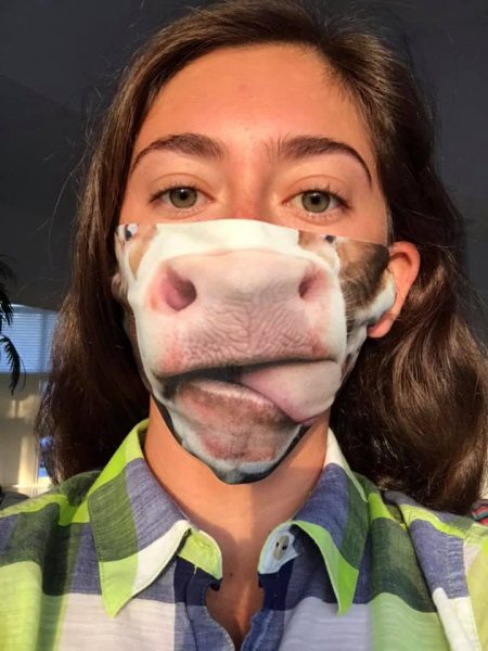 Leah wearing a cow-tongue themed face mask
