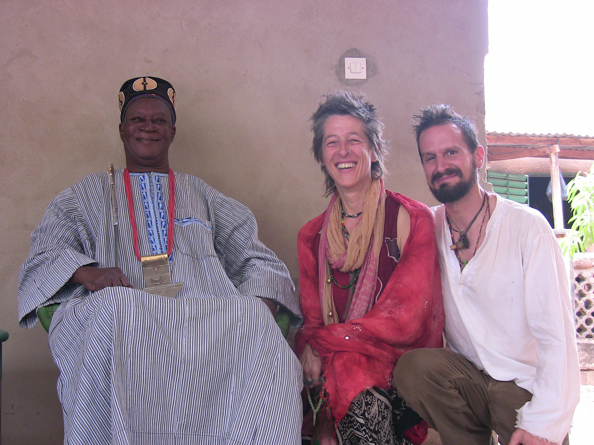 Esu, Ina and the King of Fada Three people posing for a photograph