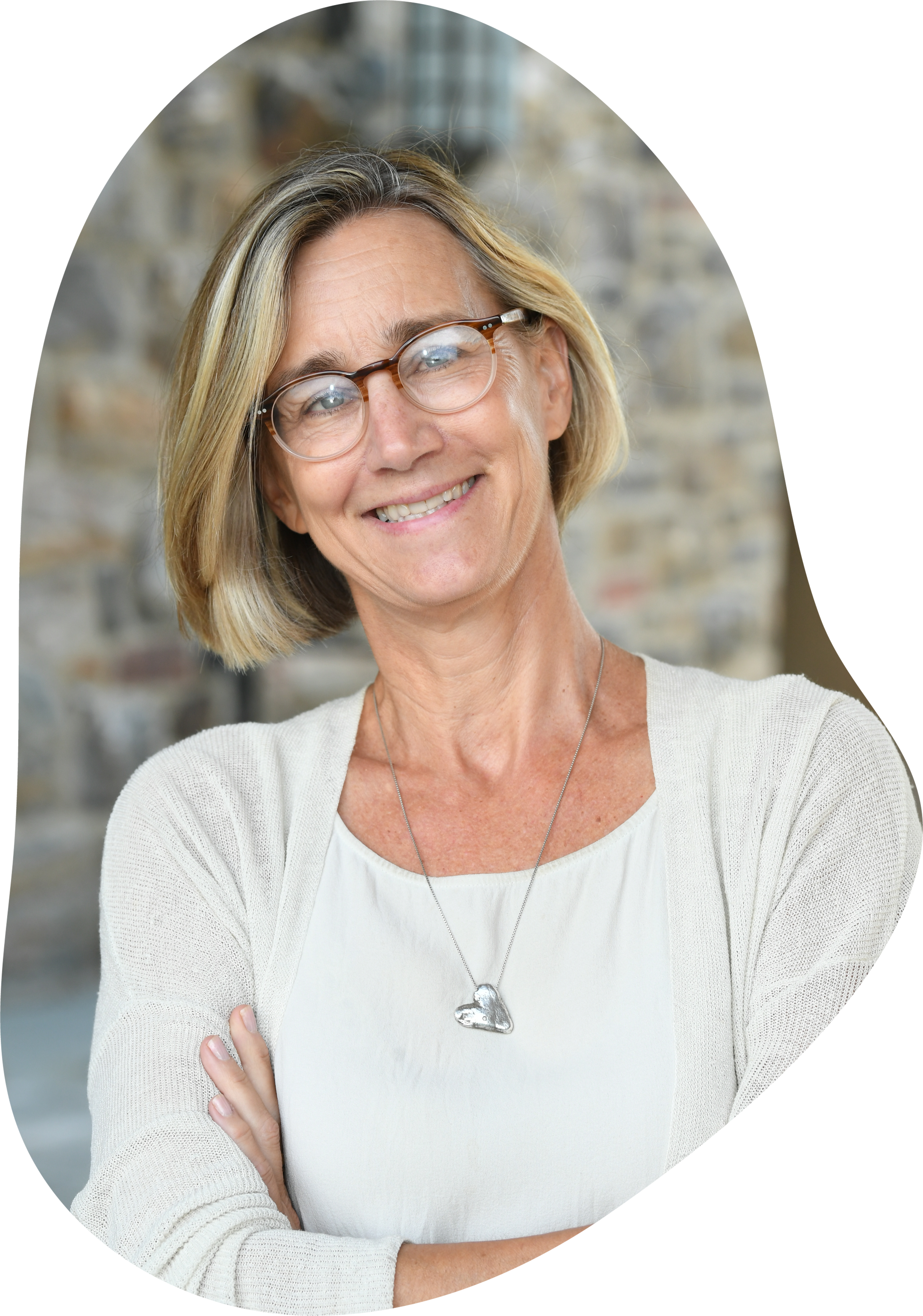 Suzy Akin ‘84 Smiling woman in white shirt