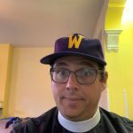 Grey wearing a Williams hat