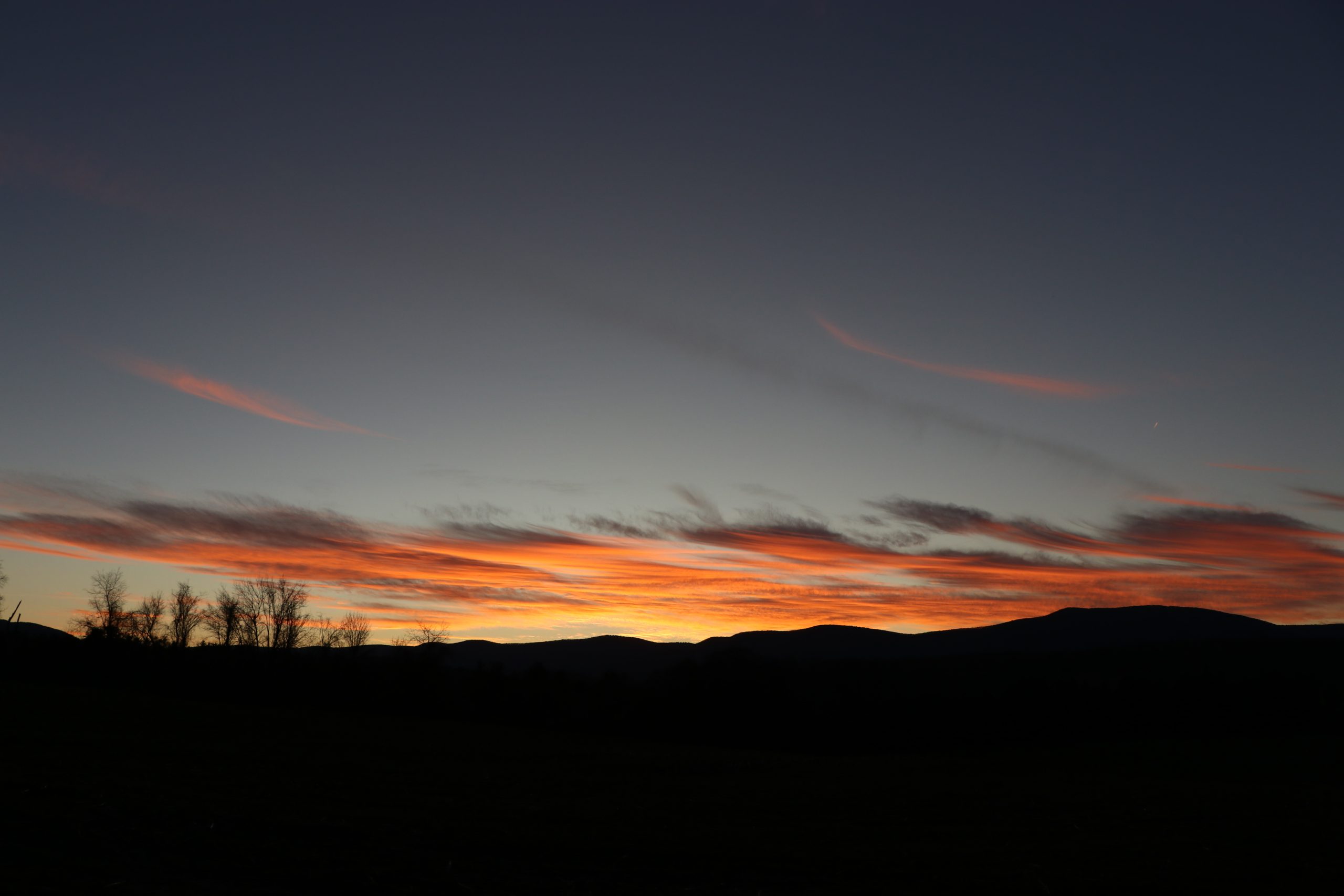 An orange and pink mountain sunset.
