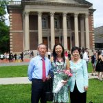 Pinsi standing with parents in front of Chapin Hall