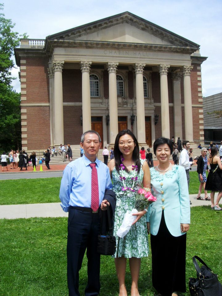 Pinsi standing with parents in front of Chapin Hall