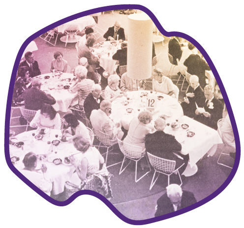 groups of people seated at tables talking