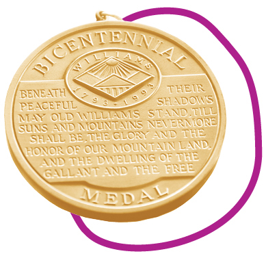 close up of medal with inscription and logo
