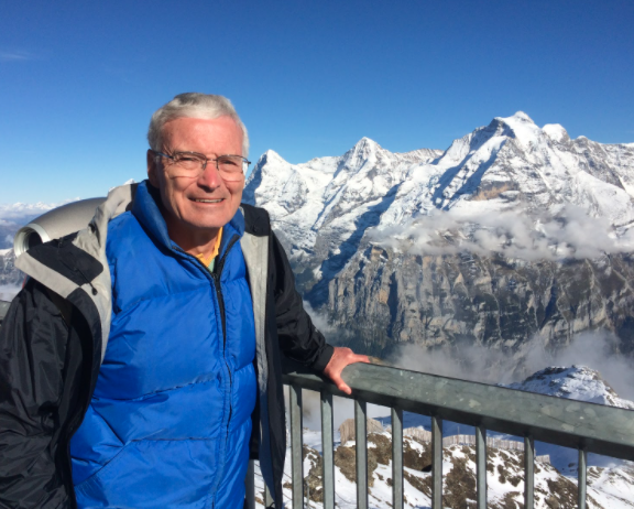 Bill Wadt at the Schilthorn looking towards the Eiger, Monch, and Jungfrau in Switzerland