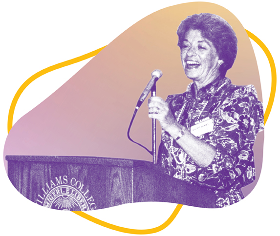 a person standing and speaking at a podium with a microphone