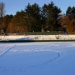 Photograph of Amherst football field covered in snow with B+ stomped into snow