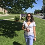 Monsie standing in front of the Williams College sign