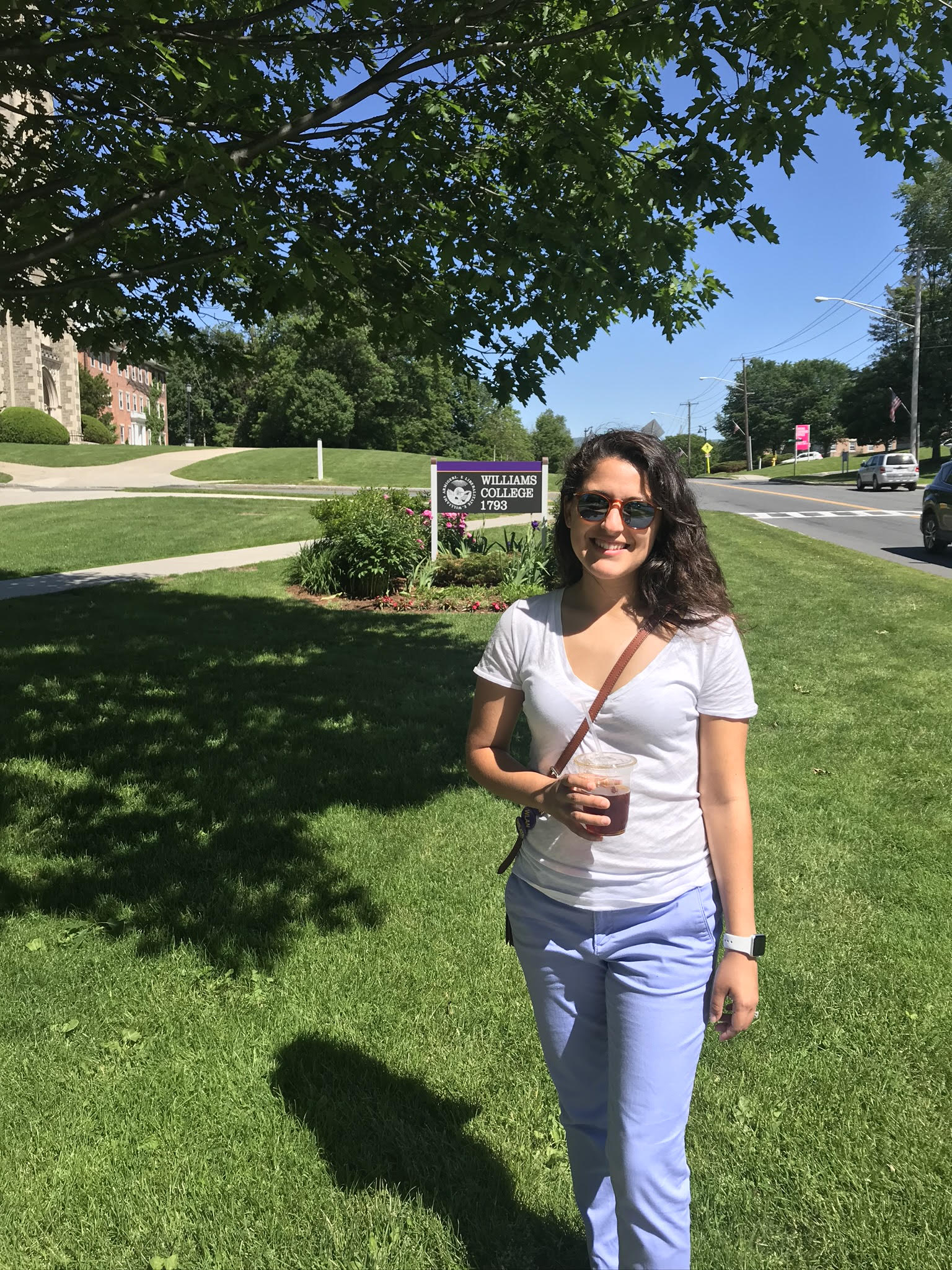 Monsie standing in front of the Williams College sign