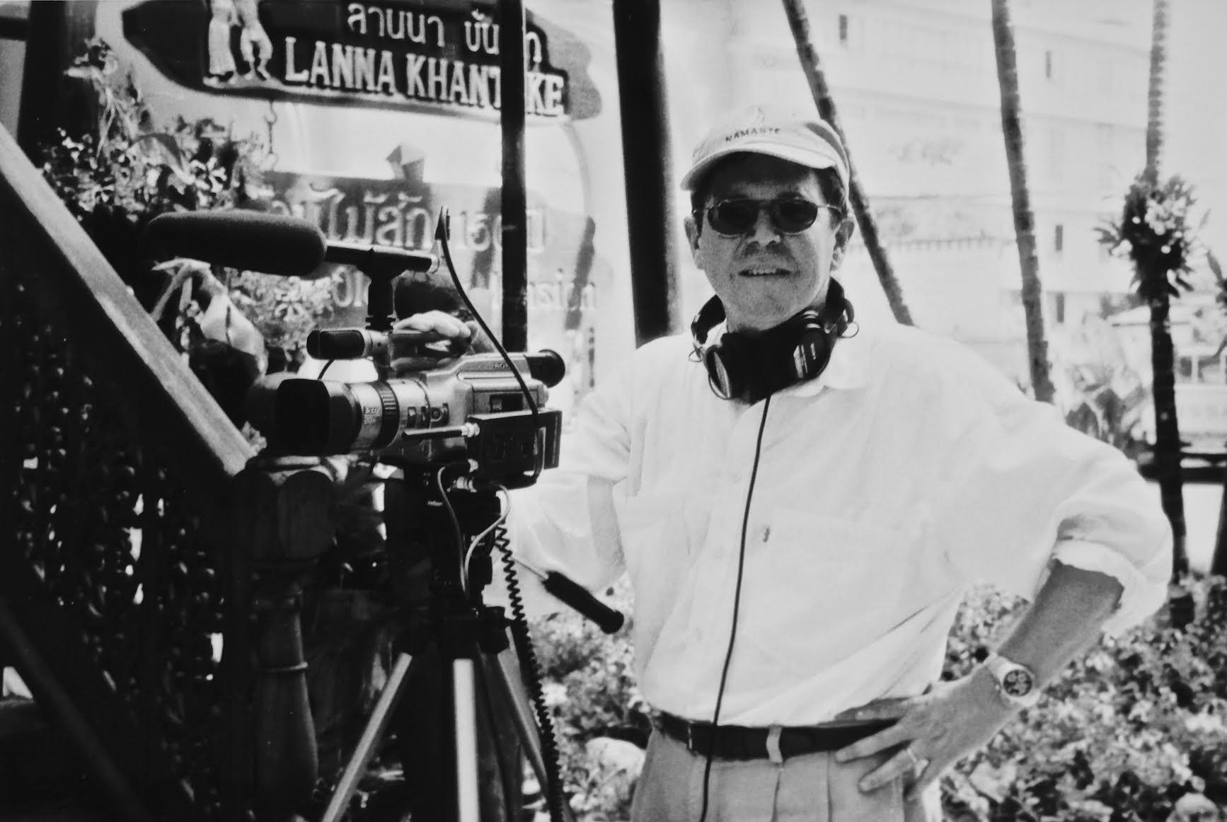 Black and white photo of Michael Rosenblum in front of video camera