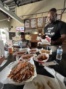 Eze serving us at one of his Wings Cafe locations.